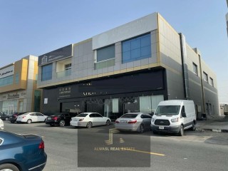 For sale a new commercial building in the Emirate of Sharjah on th